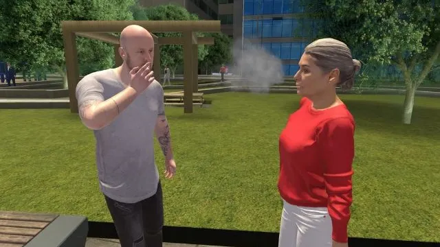 Eine Person raucht einer anderen in einem Park gegenüber