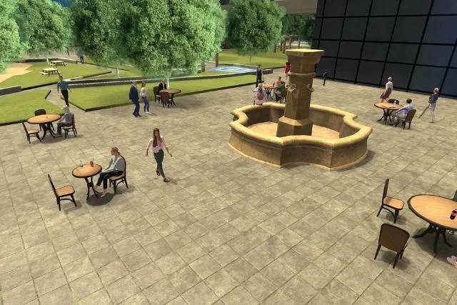 Peaceful square with a fountain and café terraces