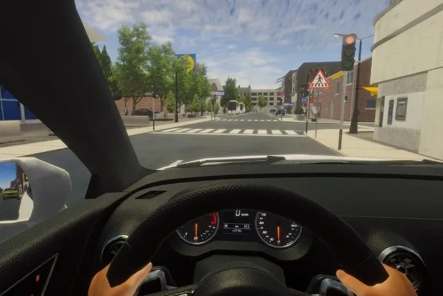 Driving on a city street with a traffic light